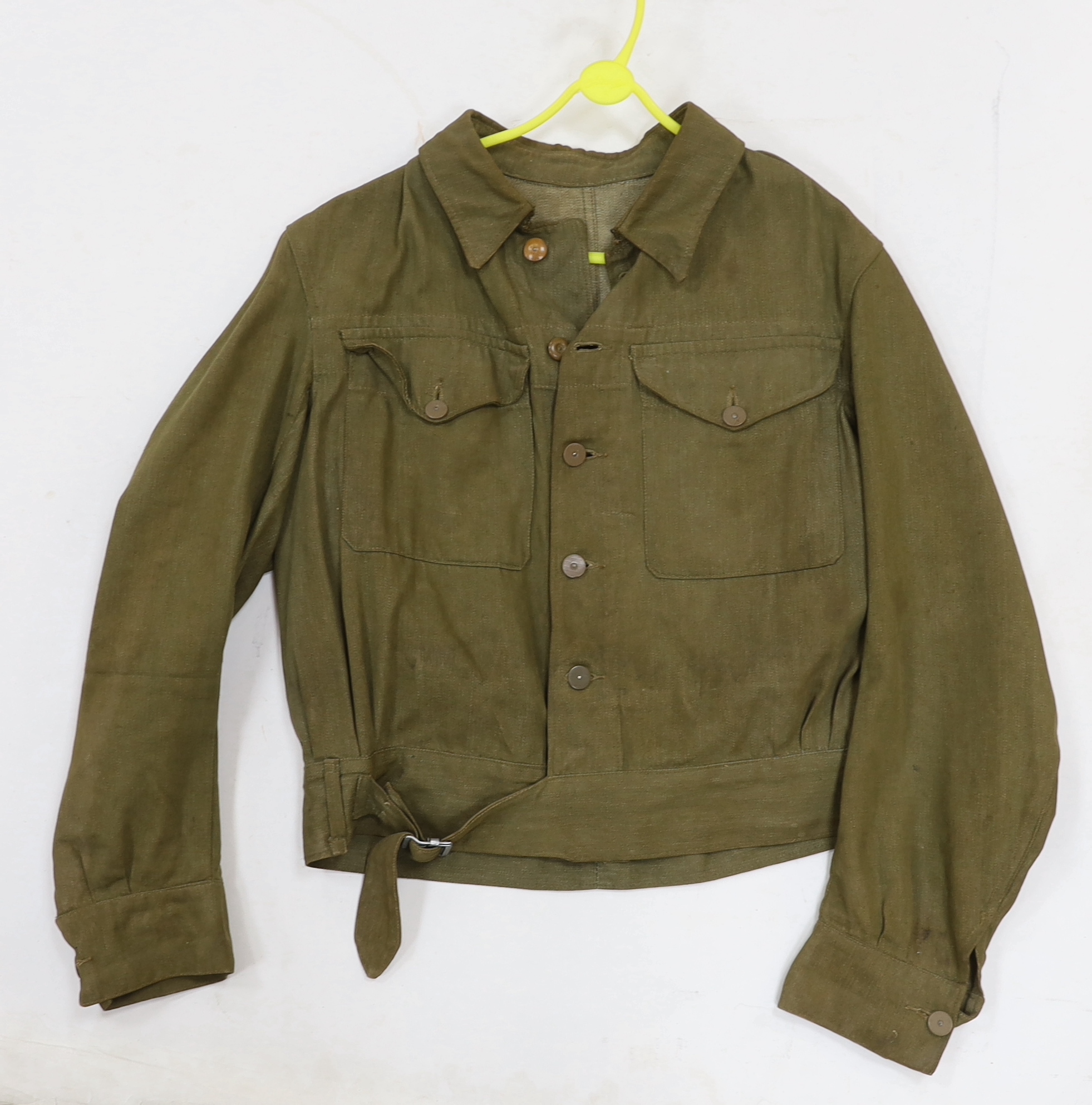Eight British military uniform blouses/jackets, including two with Royal Sussex Regiment Cinque Ports shoulder insignia, a Queen’s A.C.F. example, etc.